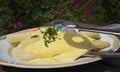 Fresh white asparagus from Beelitz on a plate with sauce hollandaise and asparagus tongs Royalty Free Stock Photo