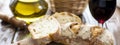 Fresh white bread, olive oil and red win., Focus on bread. Generative ai