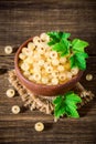 Fresh white currant in ceramic bowl on dark wooden background. Royalty Free Stock Photo