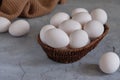 Fresh white eggs in a basket on a gray background Royalty Free Stock Photo