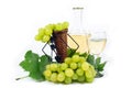 Fresh White Grapes with Green Leaves, Wine Glass Cup and Wine Bottle Filled with White Wine Isolated on White Royalty Free Stock Photo