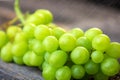 Fresh white grapes on wood