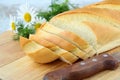 Fresh white loaf of bread with a knife Royalty Free Stock Photo