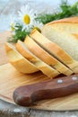 Fresh white loaf of bread with a knife Royalty Free Stock Photo