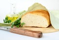 Fresh white loaf of bread with a knife Royalty Free Stock Photo