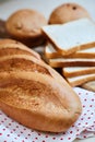 Fresh white loaf of bread, toasts and cupcakes Royalty Free Stock Photo