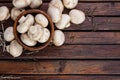 Fresh white mushrooms champignon in bowl on dark wooden background. Top view. Copy space. Royalty Free Stock Photo