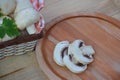 Fresh white mushrooms champignon in brown basket on wooden background. Top view. Copy space Royalty Free Stock Photo