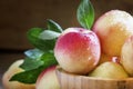 Fresh white nectarines in a wooden bowl, selective focus Royalty Free Stock Photo