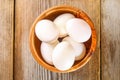 Fresh white raw chicken eggs with parsley on an old wooden table. Royalty Free Stock Photo