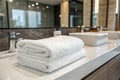 Fresh white spa towel on countertop in modern bathroom Royalty Free Stock Photo