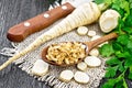 Parsley root dried in spoon on board