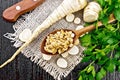 Parsley root dried in spoon on board top