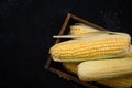 Fresh whole corn cob in wooden box Royalty Free Stock Photo