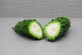 Fresh cut bitter melon on agray background Royalty Free Stock Photo