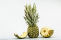 Fresh whole and cut pineapple isolated on white background. From top view Royalty Free Stock Photo