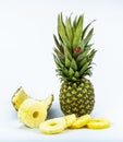 Fresh whole and cut pineapple isolated on white background. From top view Royalty Free Stock Photo