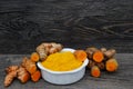 Fresh whole and cut tumeric Royalty Free Stock Photo