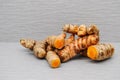 Fresh whole and cut tumeric Royalty Free Stock Photo