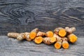 Fresh whole and cut tumeric Royalty Free Stock Photo