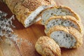 Fresh whole grain bread or rye bread slice with tea cup and fruit on rustic wooden table . selective focus. Royalty Free Stock Photo