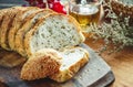 Fresh whole grain bread or rye bread slice with tea cup and fruit on rustic wooden table . selective focus. Royalty Free Stock Photo