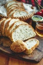 Fresh whole grain bread or rye bread slice with tea cup and fruit on rustic wooden table . selective focus. Royalty Free Stock Photo