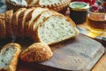 Fresh whole grain bread or rye bread slice with tea cup and fruit on rustic wooden table . selective focus. Royalty Free Stock Photo