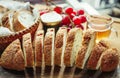 Fresh whole grain bread or rye bread slice with tea cup and fruit on rustic wooden table . selective focus. Royalty Free Stock Photo