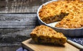 Fresh Whole Meat pie on the wooden board on table background. Cooked meat pie Royalty Free Stock Photo