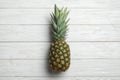 Fresh whole pineapple on white wooden background Royalty Free Stock Photo