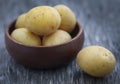 Fresh whole potatoes wooden bowl