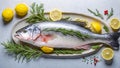 Fresh whole raw fish on a light background, lemon, rosemary healthy diet delicious