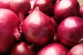 Fresh whole red onions as background Royalty Free Stock Photo