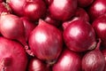 Fresh whole red onions as background Royalty Free Stock Photo