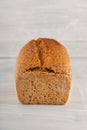 Fresh wholegrain bread on white wooden kitchen table Royalty Free Stock Photo