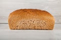 Fresh wholegrain bread on white wooden kitchen table Royalty Free Stock Photo