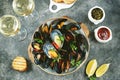 Fresh wild mussels in shells with green onions, garlic, parsley, chili pepper, white wine and olive oil. Royalty Free Stock Photo