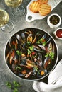 Fresh wild mussels in shells with green onions, garlic, parsley, chili pepper, white wine and olive oil. Royalty Free Stock Photo