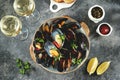 Fresh wild mussels in shells with green onions, garlic, parsley, chili pepper, white wine and olive oil. Royalty Free Stock Photo