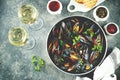 Fresh wild mussels in shells with green onions, garlic, parsley, chili pepper, white wine and olive oil. Royalty Free Stock Photo