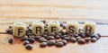 Fresh on wooden block with group of coffee beans on table. fresh and enery beverage concept Royalty Free Stock Photo