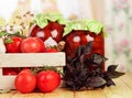 Fresh in wooden box and cans canned tomatoes, spices isolated. Royalty Free Stock Photo