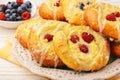 Fresh yeast buns with cheese and berries. Royalty Free Stock Photo