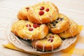 Fresh yeast buns with cheese and berries. Royalty Free Stock Photo
