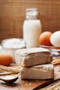 Fresh yeast and ingredients for baking on kitchen table. Product for preparing pizza or bread. Royalty Free Stock Photo