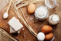 Fresh yeast and ingredients for baking on rustic kitchen table from above. Product for preparing pizza or bread.