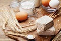 Fresh yeast and ingredients for Easter baking on rustic kitchen background. Royalty Free Stock Photo