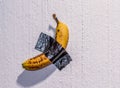 Banana stuck on a wall Royalty Free Stock Photo