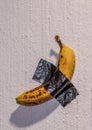 Banana stuck on a wall Royalty Free Stock Photo